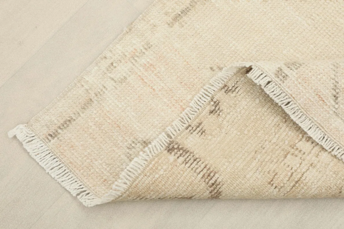 Corner view of the back of the hand-knotted runner, showing the cotton foundation and construction