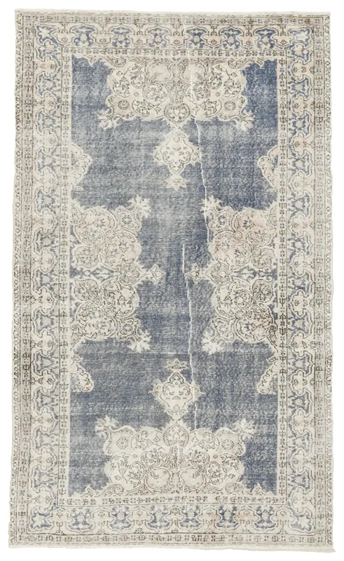 Full top view of the 4'11" x 8'2" blue geometric medallion vintage Anatolian rug