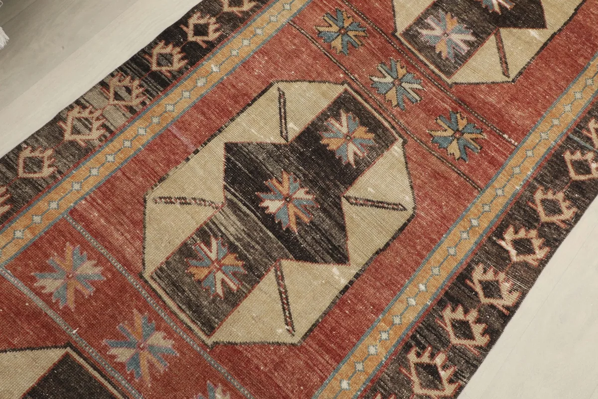 Detailed view of the repeating geometric motifs and the subtle color variations in the pile