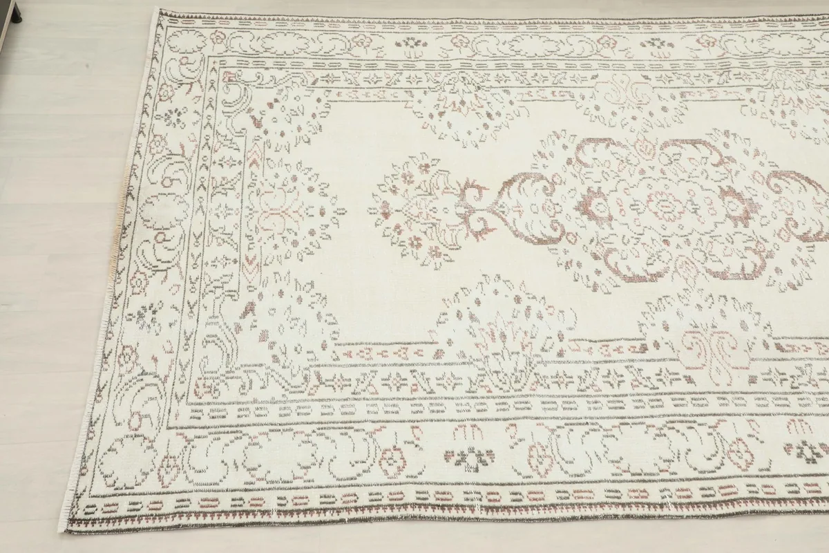 Another angled perspective highlighting the intricate floral and geometric patterns and the rug's overall shape.