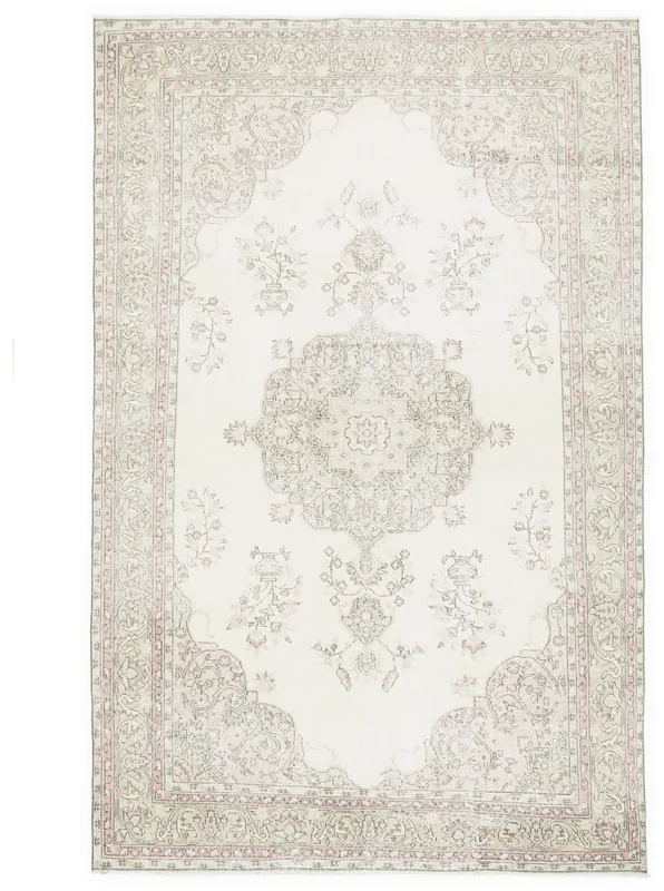 Full top view of an ivory pink vintage Anatolian area rug with a central medallion