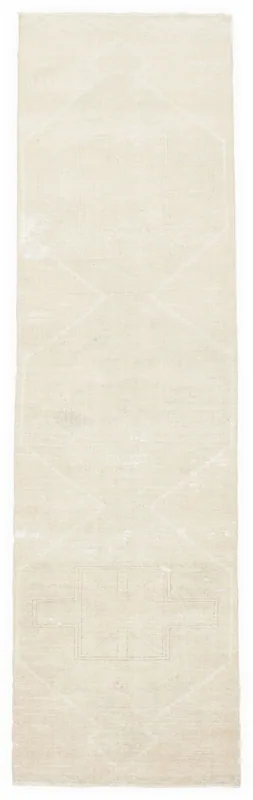 Full overhead view of the 2'11" x 11'7" beige vintage runner rug on a white background.