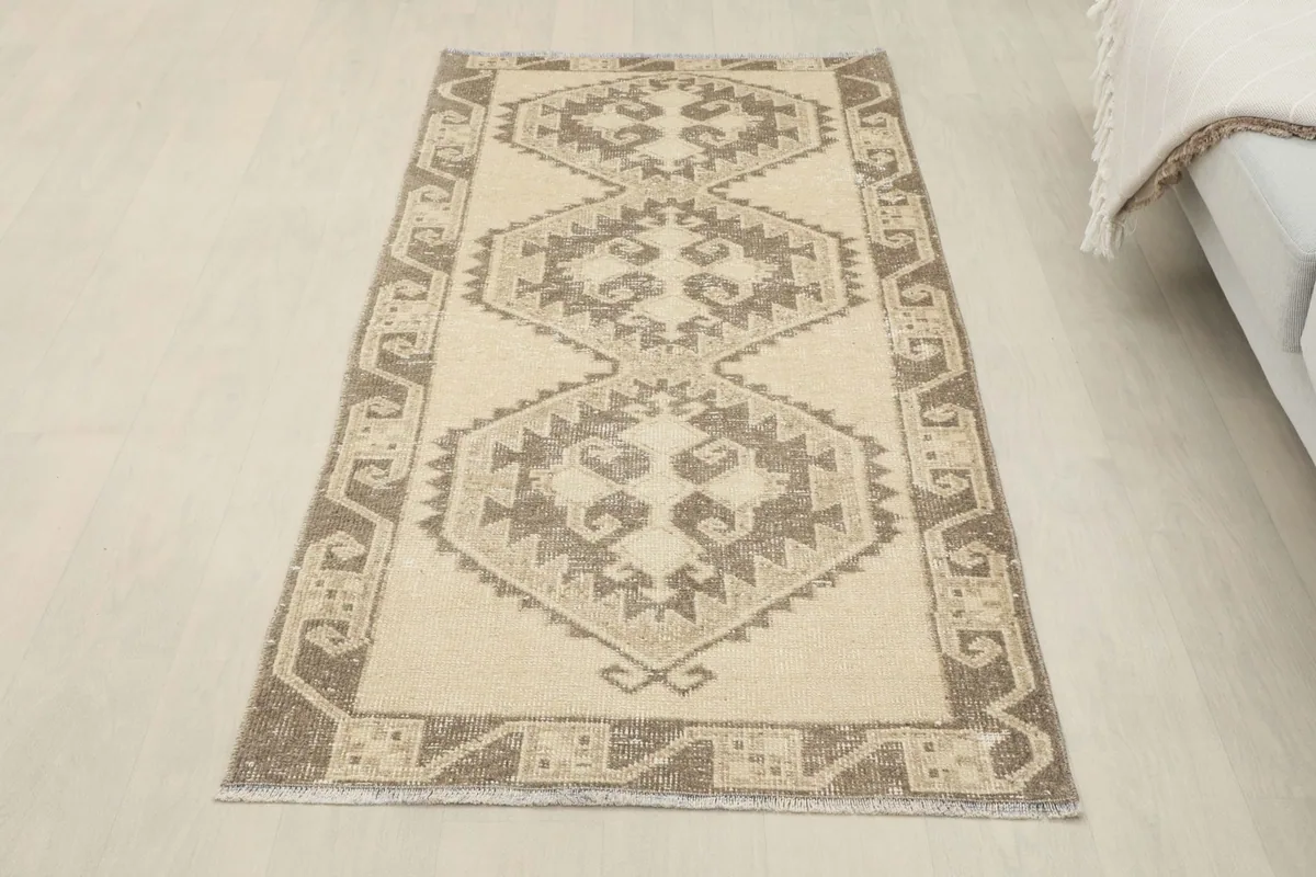 Full overhead view of the beige and brown geometric runner in a room setting