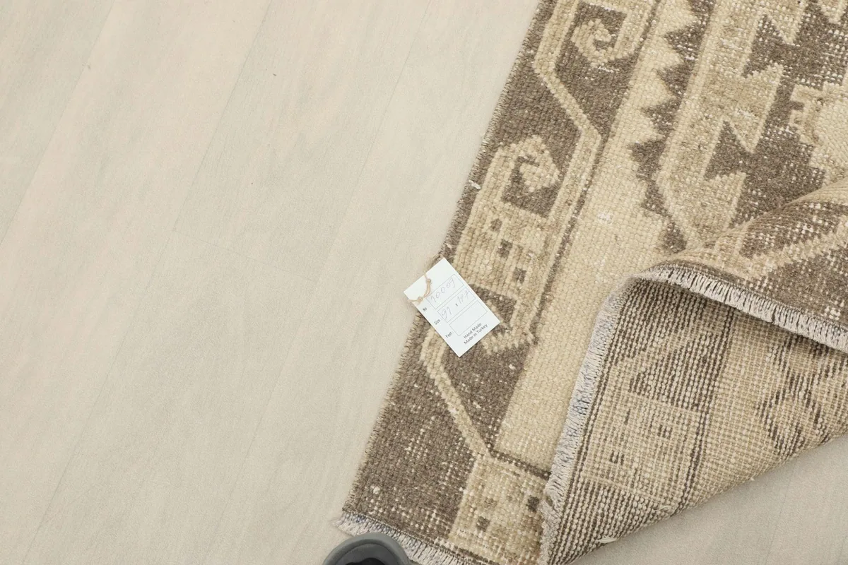 Overhead view of the rug with an information tag visible on the surface