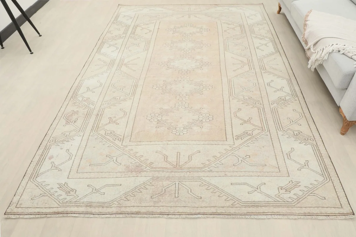 Full room view of the vintage rug, offering a sense of its scale and presence in a space