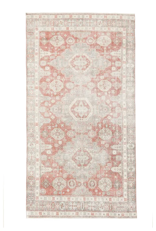 Full overhead view of the rust and gray geometric medallion vintage area rug
