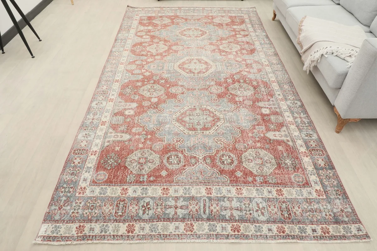 Full room view of the vintage rust and gray area rug in a modern setting