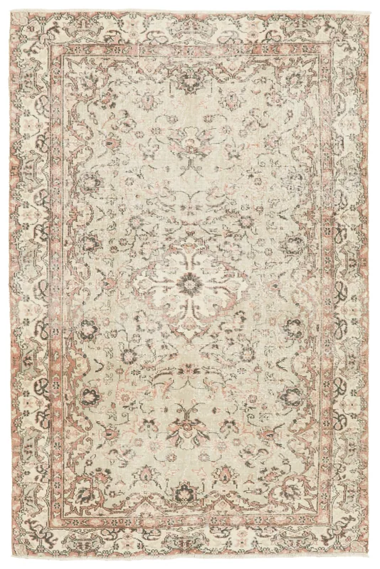 Full top view of the vintage Anatolian area rug with an ivory field and rose floral medallion.