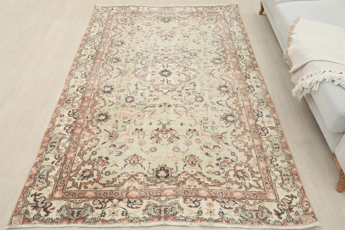 Overhead view of the vintage Anatolian rug, showing its overall shape and design in a room setting.
