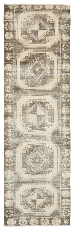 Full top view of the brown and ivory geometric Anatolian runner rug on a white background.