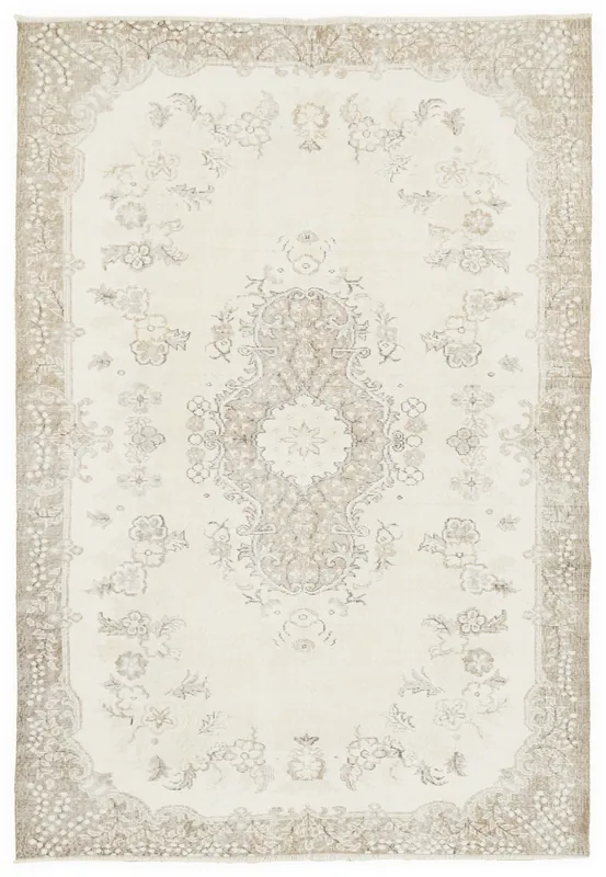 Full overhead view of the ivory and tan floral medallion vintage Anatolian rug