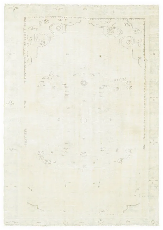 Full overhead view of the ivory geometric vintage rug on a white background