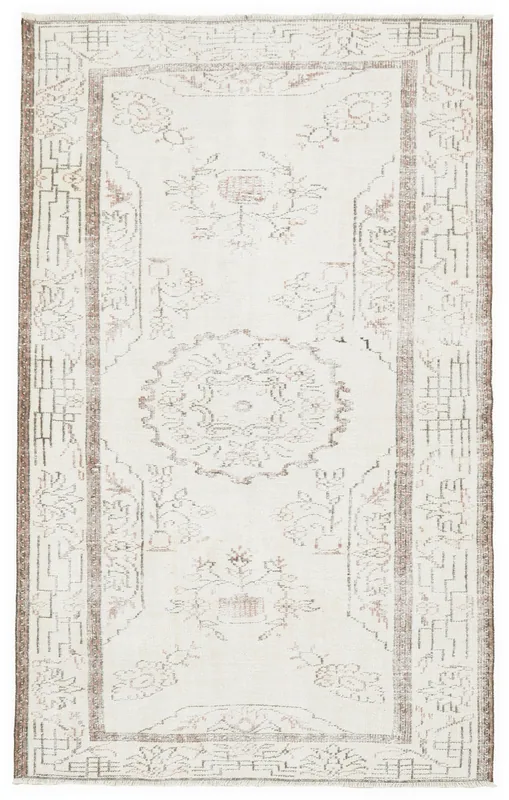 Full overhead view of the 5x8 ivory vintage Anatolian rug with rust and brown patterns