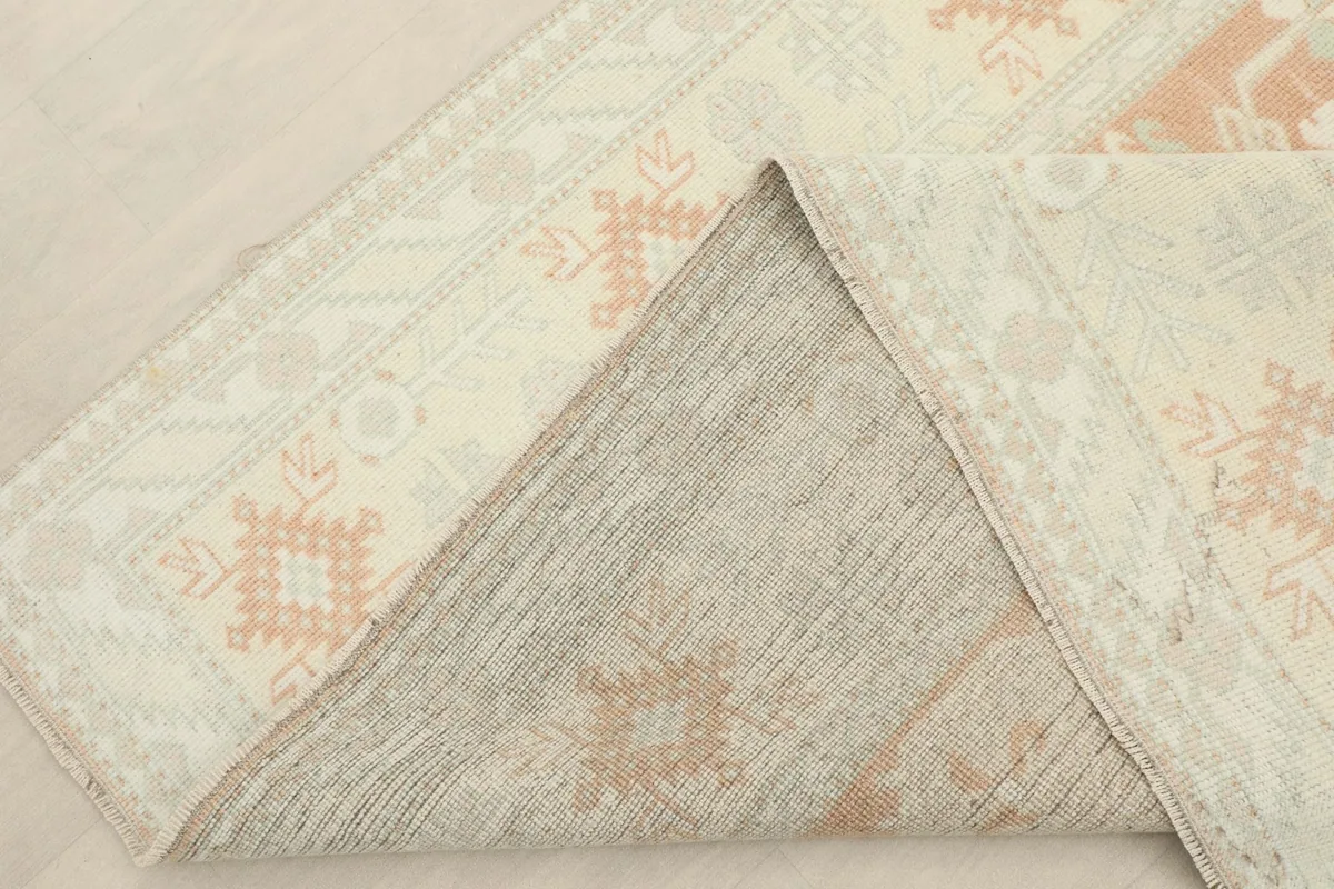 Folded corner showing the hand-knotted wool pile on a cotton foundation