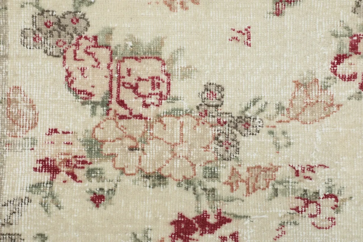 Close-up of the hand-knotted wool pile, revealing the texture and subtle color variations