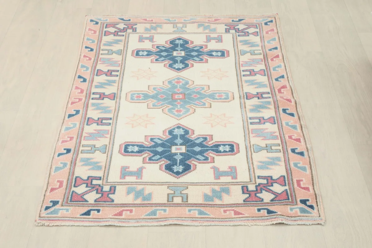 Full overhead view of the vintage Anatolian rug, showcasing its complete design and colors
