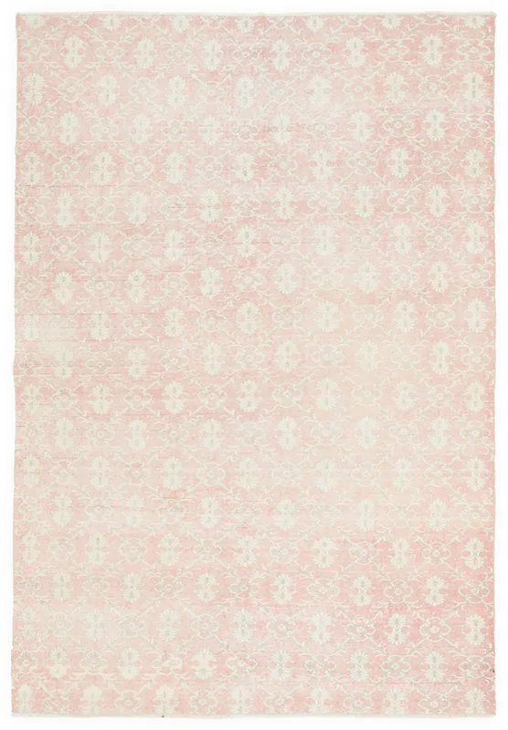 Full top view of the 6'9" x 10'6" vintage pink and ivory Anatolian area rug