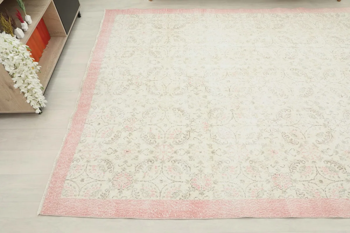 Another angled view of the vintage area rug, showcasing its dimensions and placement in a room