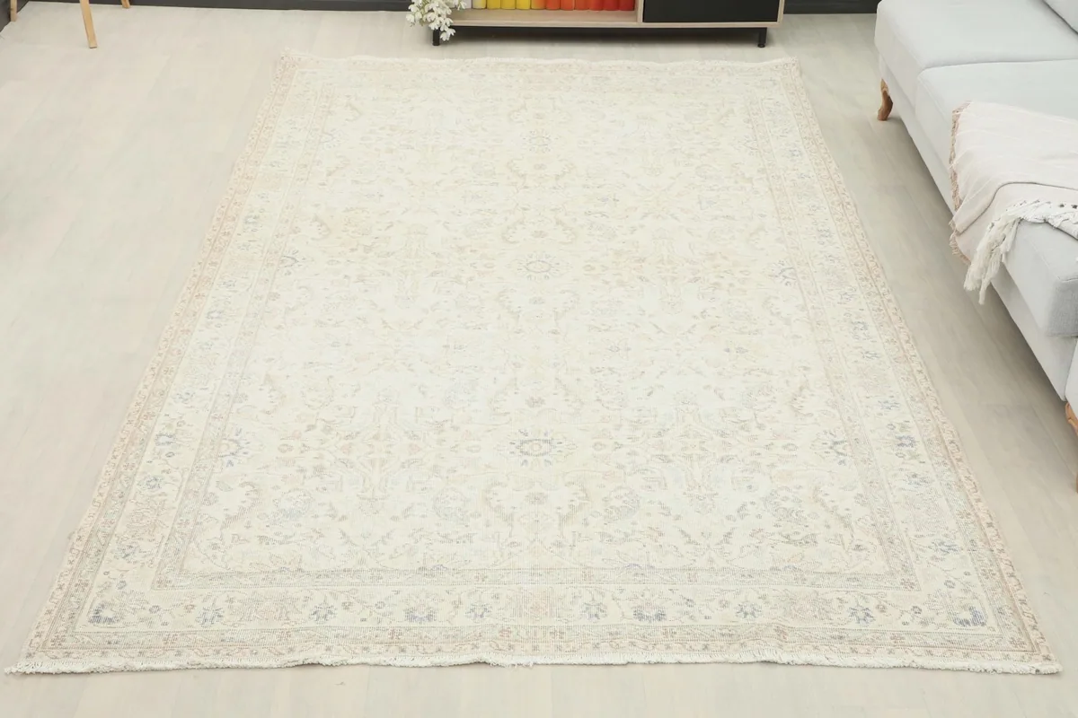 Overhead view of the ivory vintage rug in a spacious room, emphasizing its large size