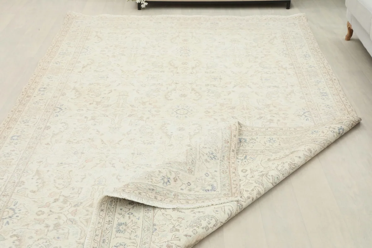 The rug folded to show its flexibility and overall size in a room setting