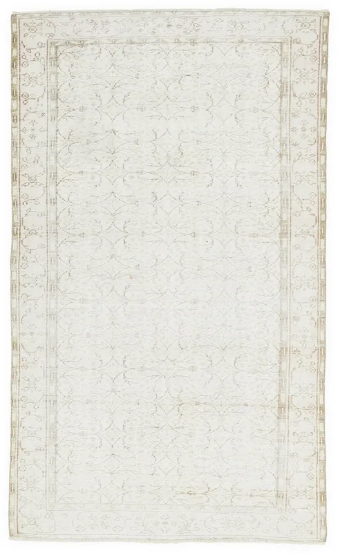 Full overhead view of the 5'5" x 9'3" ivory and beige vintage Anatolian rug on a white background.