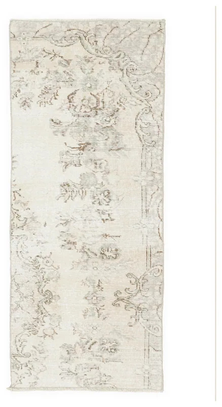 Full top view of the 2'5" x 5'11" ivory vintage Anatolian runner on a white background.