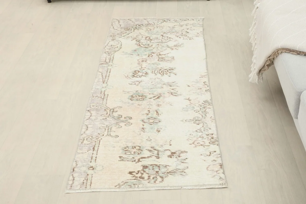 Full view of the ivory runner rug in a room, offering a sense of its size and scale.