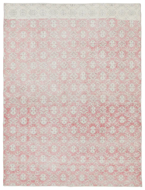 Full top view of the 6'8" x 10'3" pink and cream vintage Anatolian area rug on a white background.