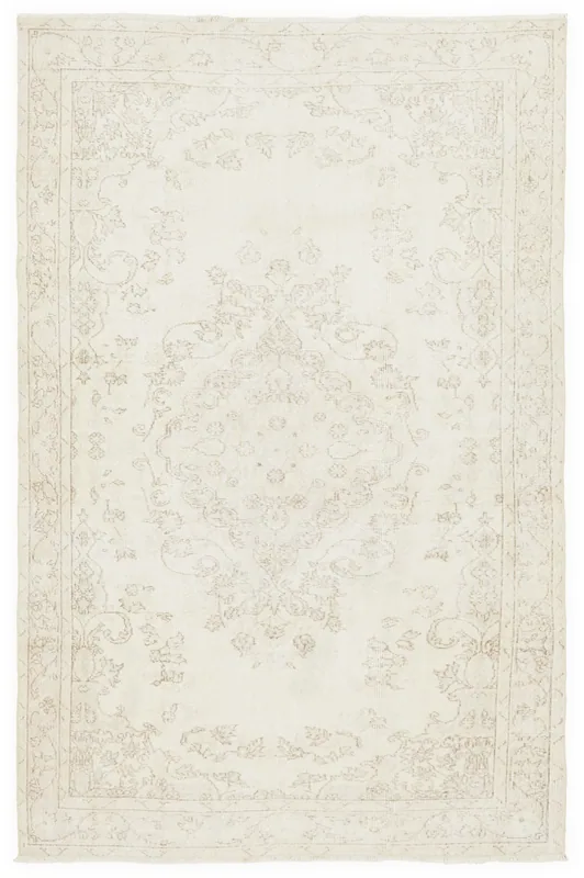 Full top view of the 5'2" x 8'5" ivory tonal medallion vintage Anatolian rug on a white background.