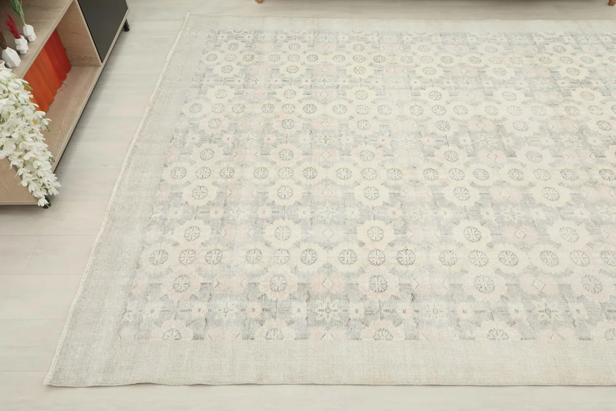 Detail of the rug's edge and corner, showing the overall pattern and border design.