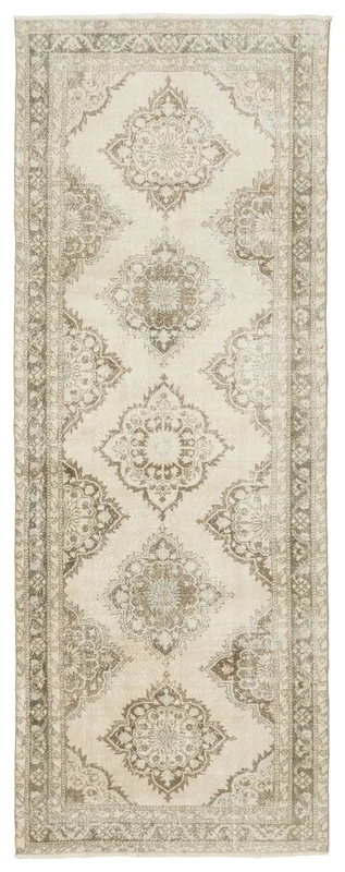 Full overhead view of the 4'7" x 12'6" vintage Anatolian runner with ivory field and brown medallions.