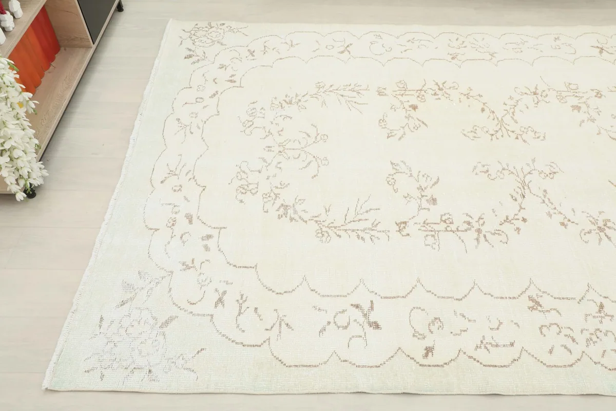 Another angled view of the ivory beige rug, showing its full design and texture