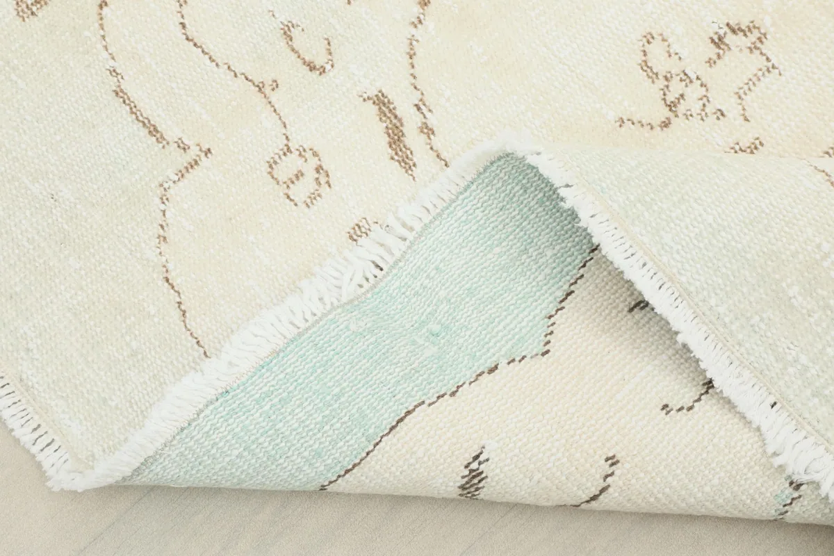 View showing the cotton foundation and reverse side of the hand-knotted vintage rug