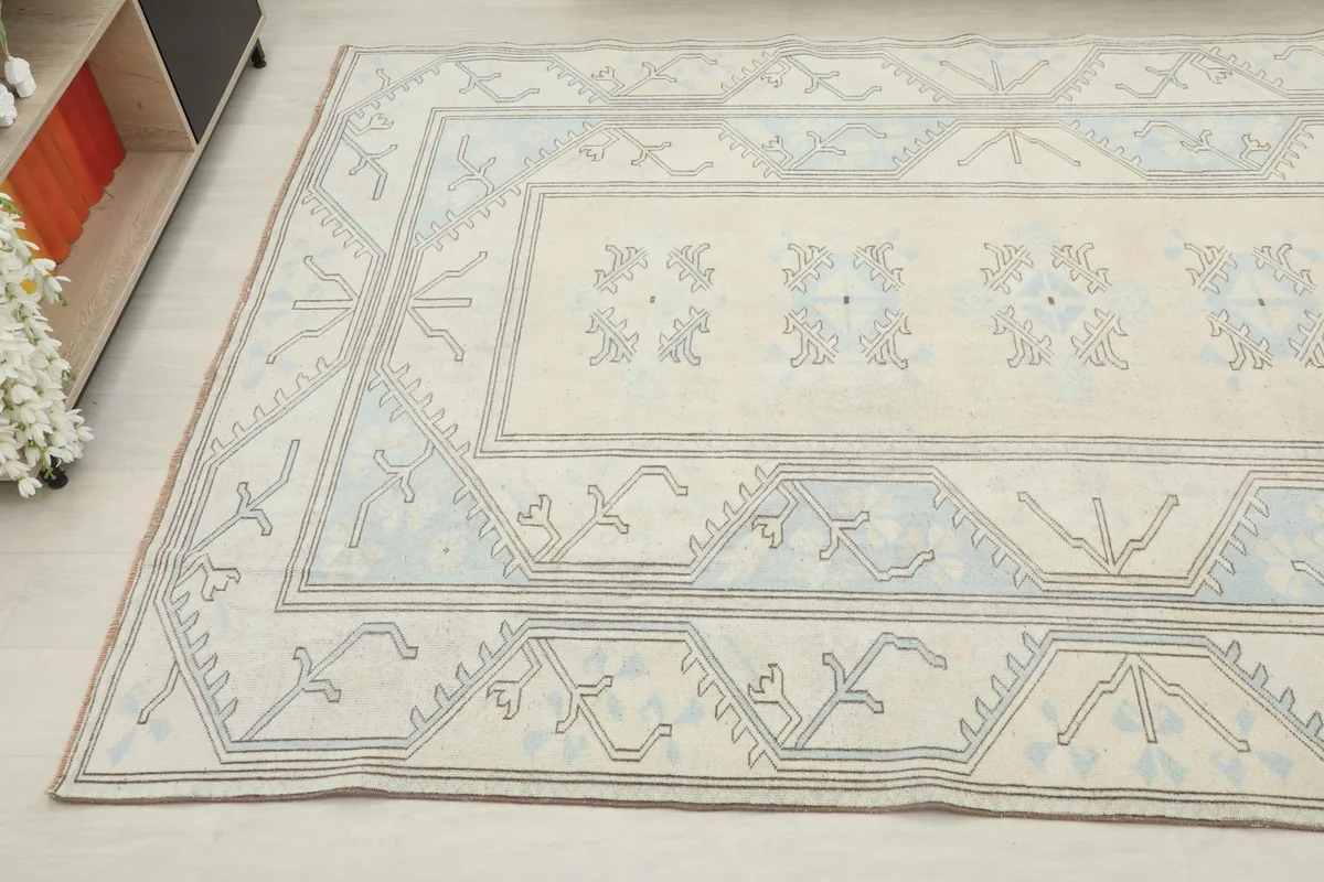 Overhead view from an angle, showing the full design of the vintage wool rug