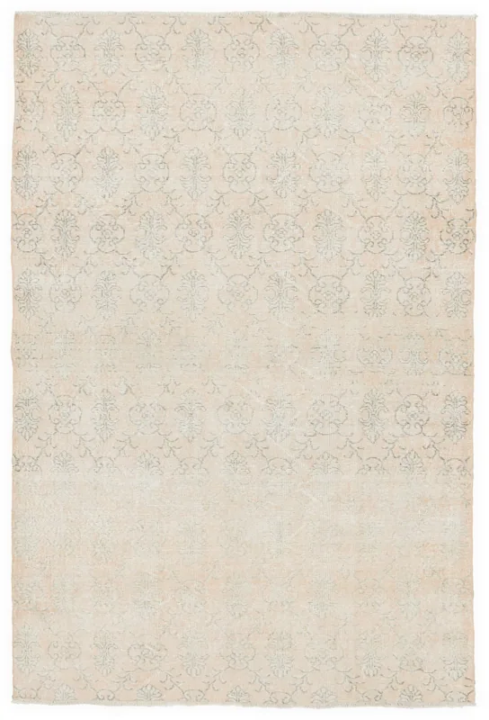 Full overhead view of a 5'5" x 8'9" cream and gray floral vintage Anatolian rug on a white background.