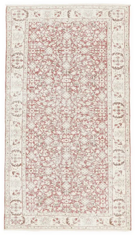 Full top view of the vintage rose and ivory Anatolian rug on a white background