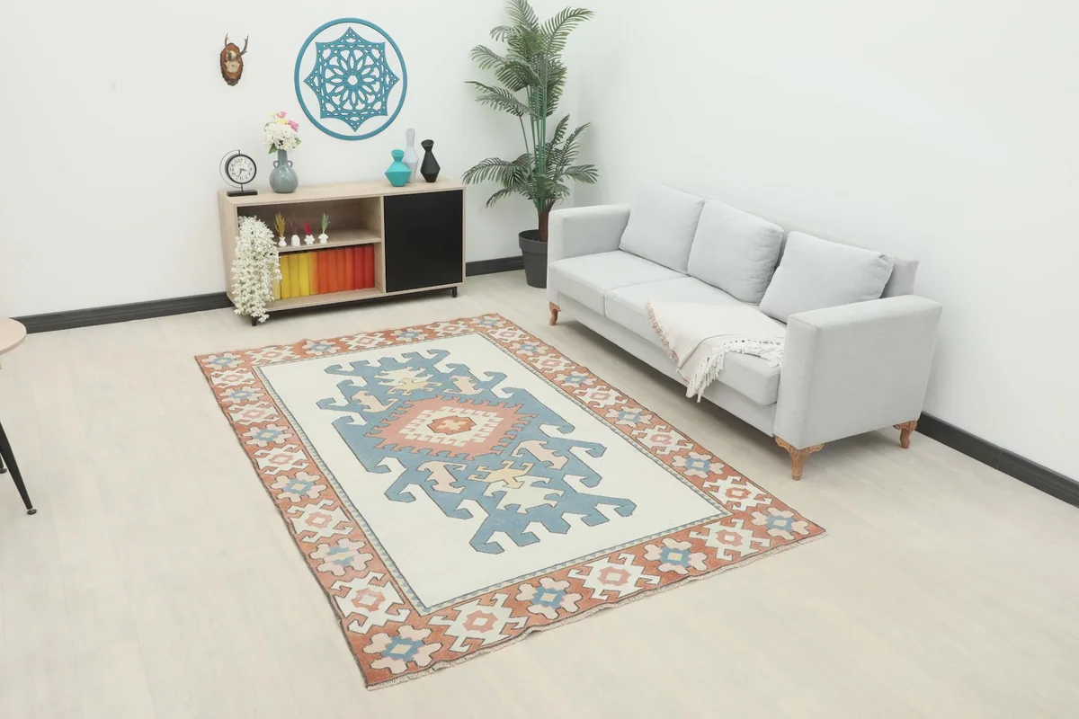 Vintage Anatolian rug in a modern living room setting with a gray sofa