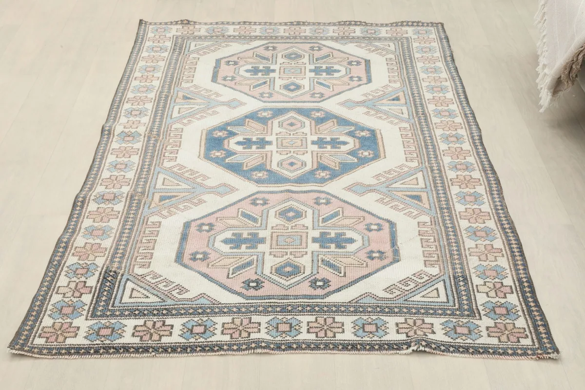 Full room view of the rug laid flat on a light floor, complementing modern home decor
