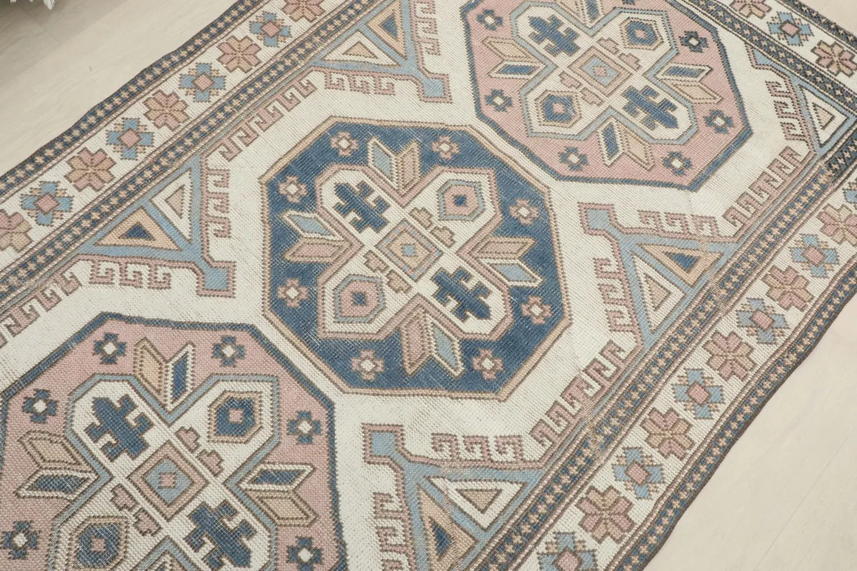 Overhead view focusing on the central blue geometric medallion and surrounding patterns