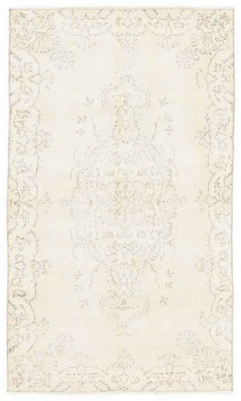Full top view of the 4x7 cream faded medallion vintage rug on a white background