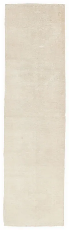 Full overhead view of the 2'11" x 12'0" cream vintage Anatolian runner on a white background
