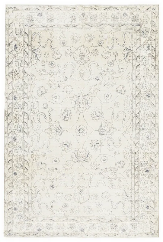 Full top view of the 6'7" x 10'6" ivory and blue floral vintage Anatolian area rug