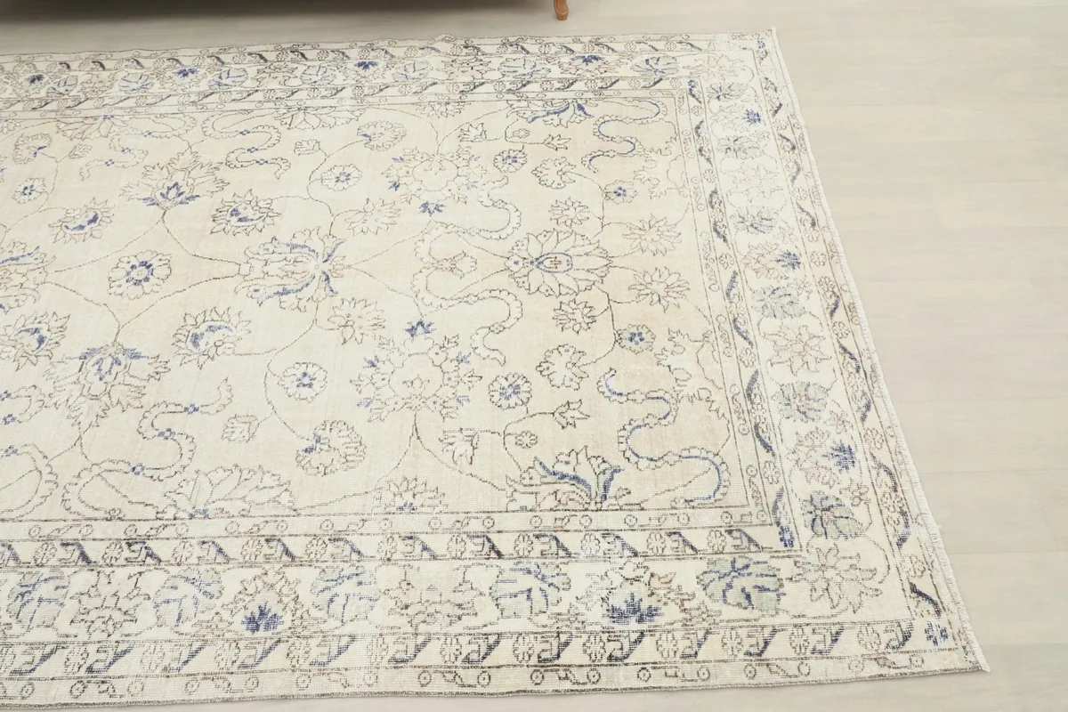 Corner view of the hand-knotted rug showing the border design and main field