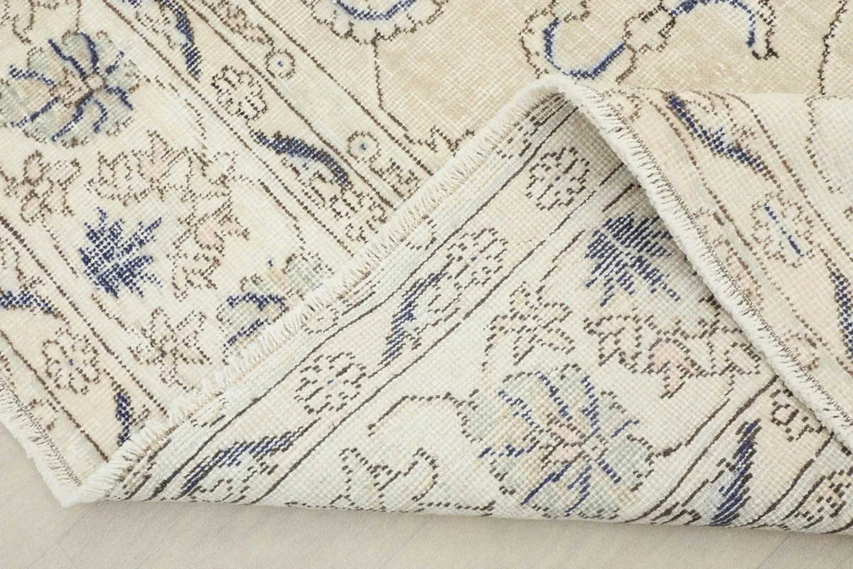 View showing the back of the hand-knotted wool rug, revealing its construction