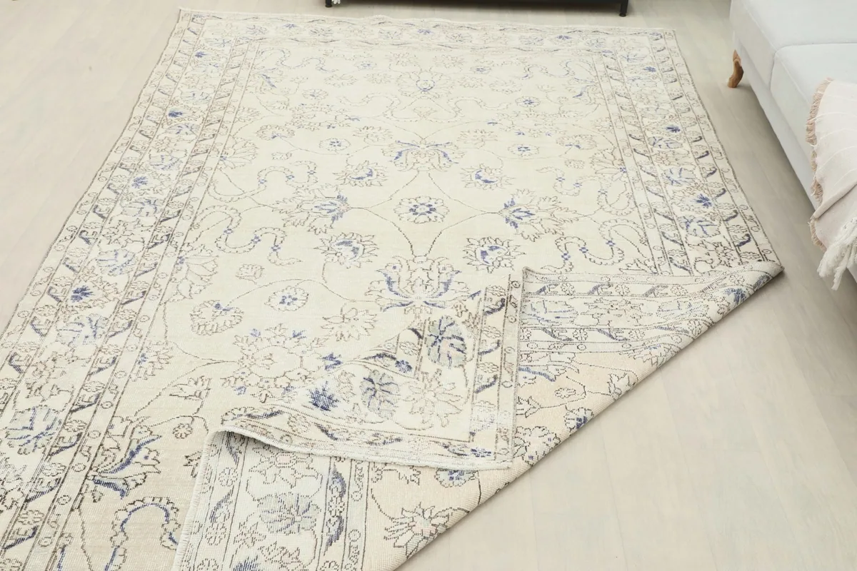 Folded corner of the rug demonstrating its flexibility and thickness
