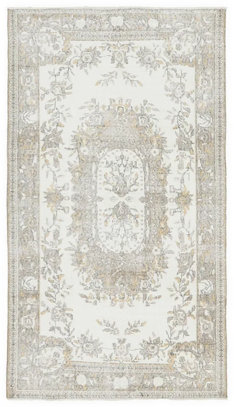 Full top view of the ivory and beige floral vintage Anatolian rug