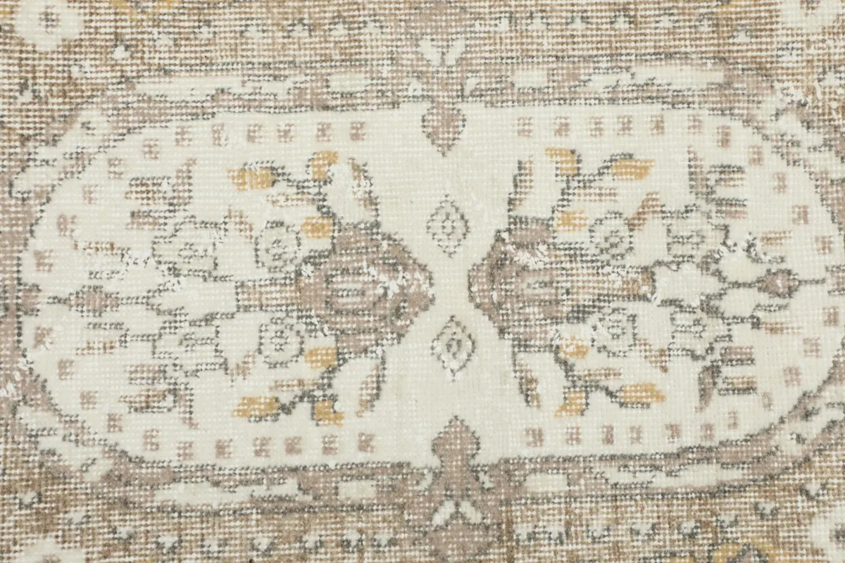 Close-up of the central motif, showing the intricate hand-knotted texture