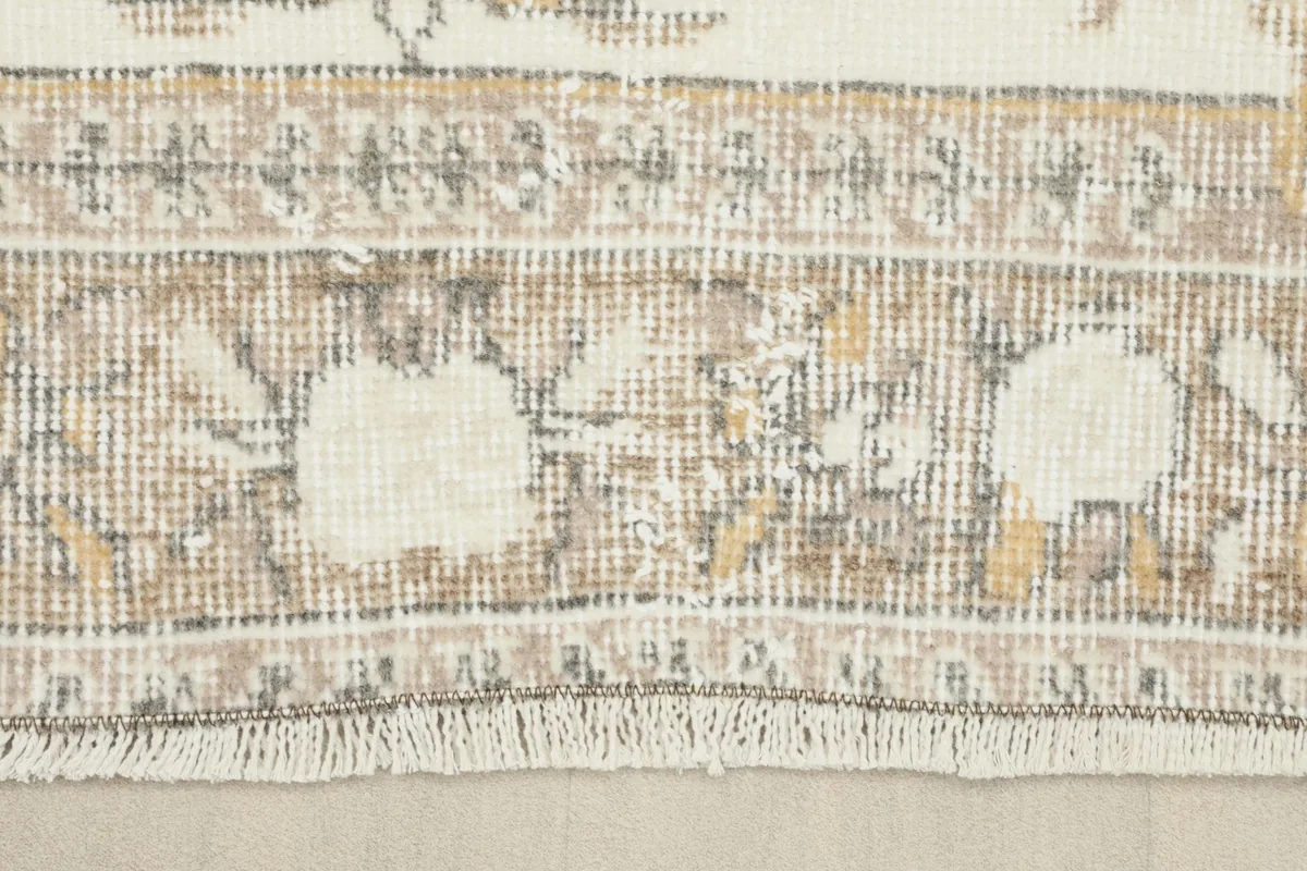 Detail of the short, subtle fringe and the edge of the hand-knotted rug