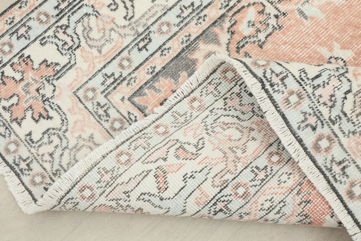 View of the back of the hand-knotted vintage Anatolian rug, showing the cotton foundation