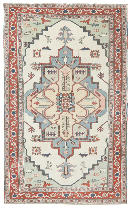 Full overhead view of the vintage ivory and red Anatolian rug
